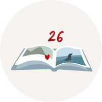 Open fotoboek met een hartvormige decoratie op een pagina en het getal 26 erboven