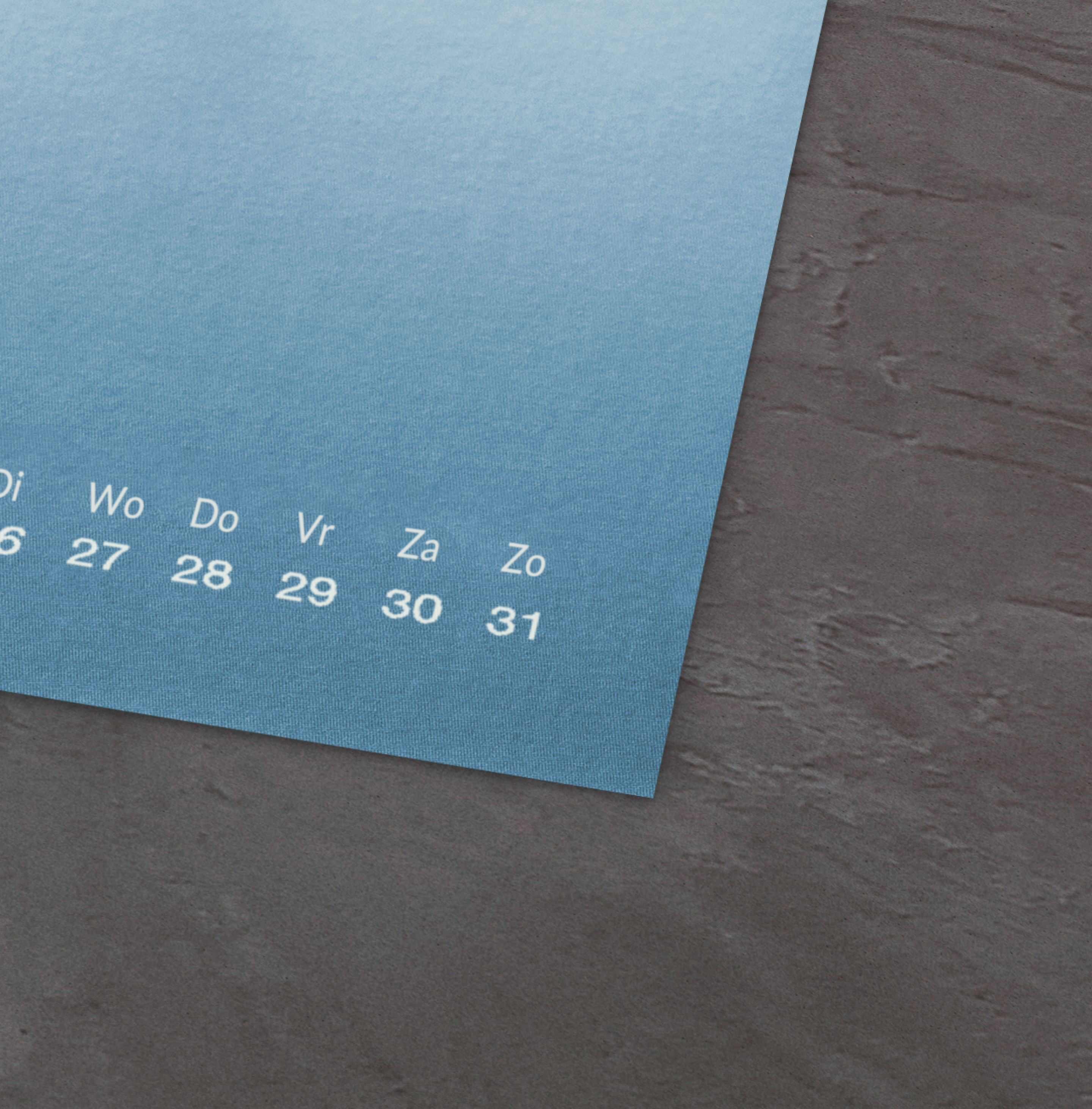 Een moderne blauwe fotokalender met stijlvol ontwerp.