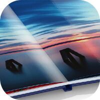 Gros plan d'un livre photo CEWE ouvert avec de magnifiques paysages.