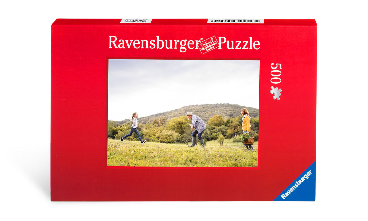 Boîte rouge du puzzle Ravensburger montrant des enfants jouant dehors
