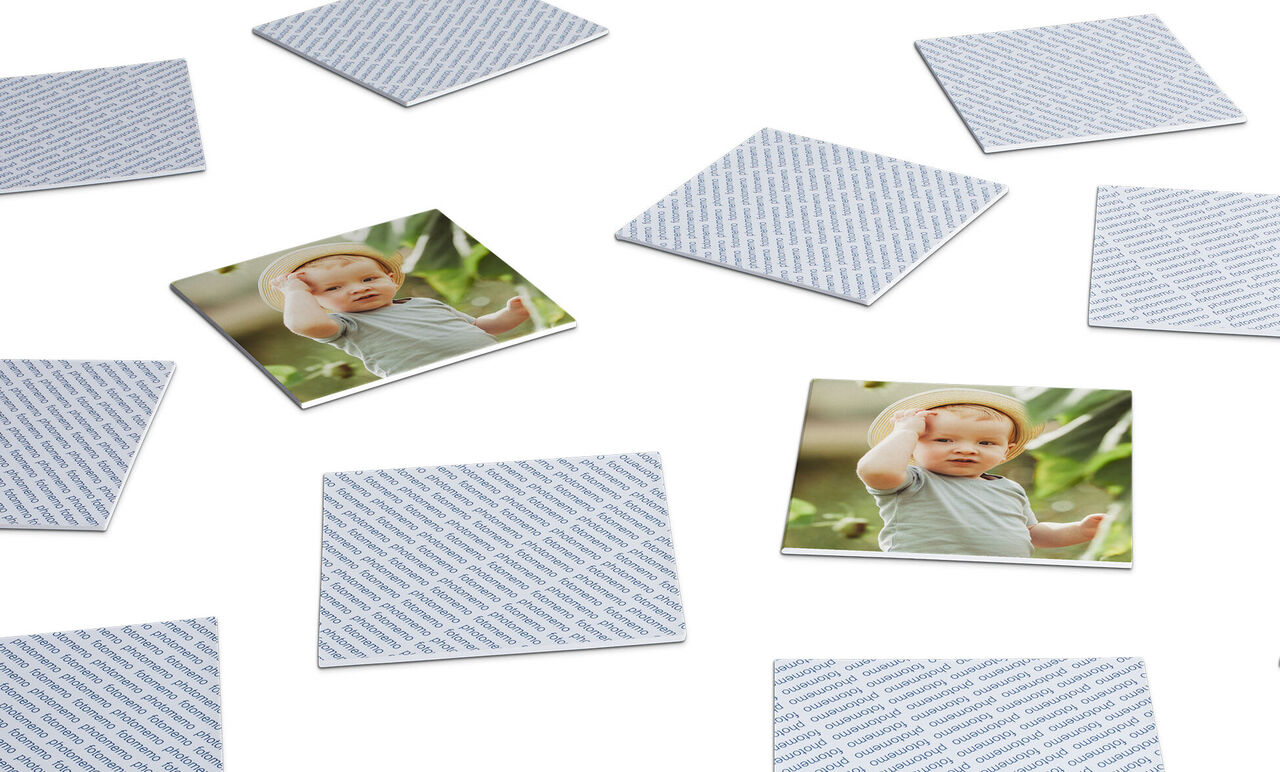 Plusieurs cartes de quartett superposées avec photos et textes.